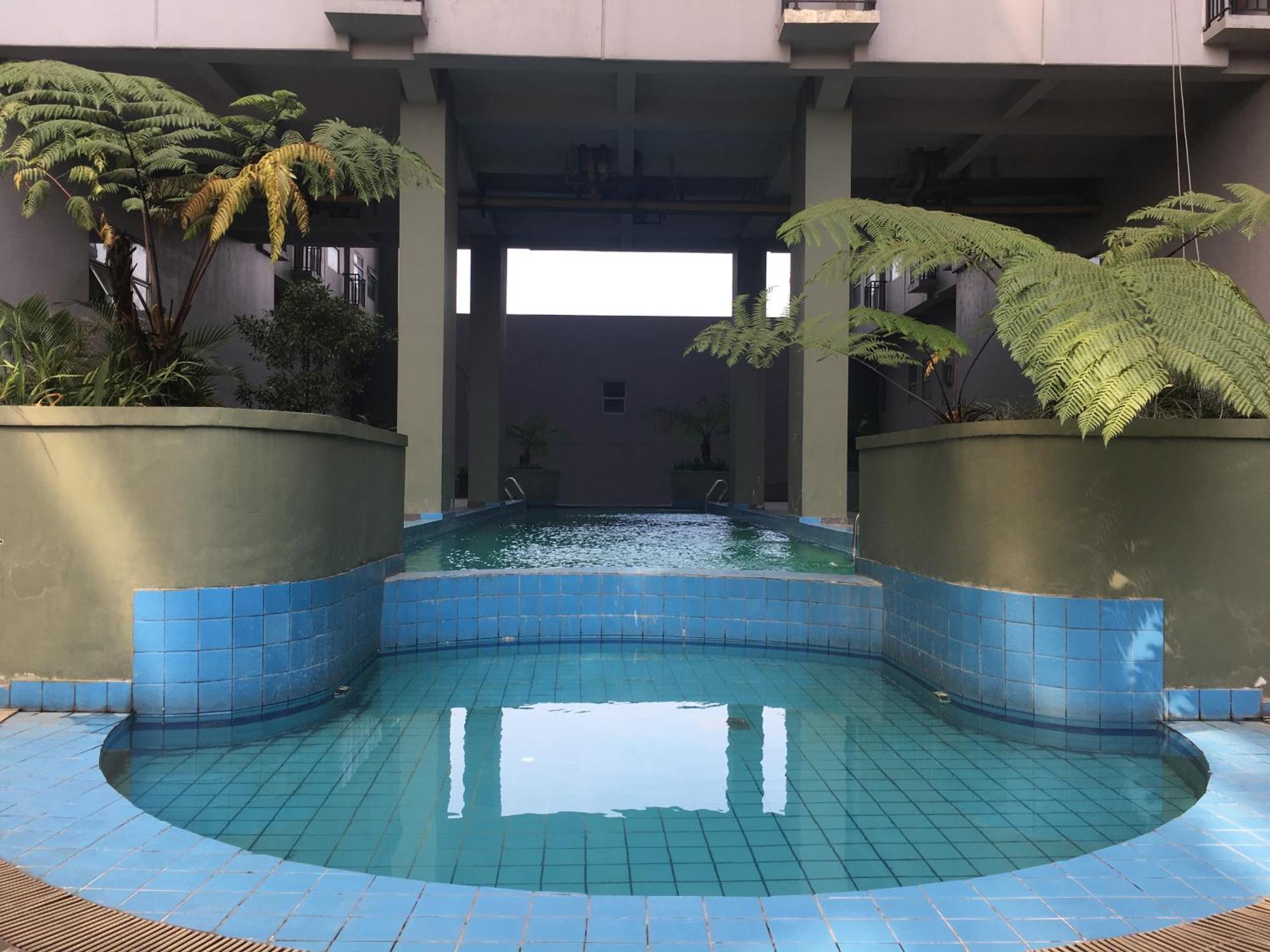 Cozy At Grand Afrika By Travelio Apartemen *